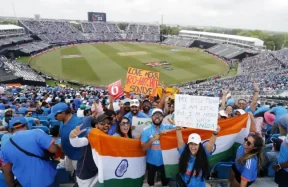 A photo from the India vs Ireland T20 World Cup match, showcasing a bowler (possibly Hardik Pandya) in action, bowling with intensity, eyes fixed on the batsman.