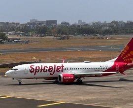 SpiceJet passenger airplane on a runway, with the SpiceJet logo prominent on the tail fin.