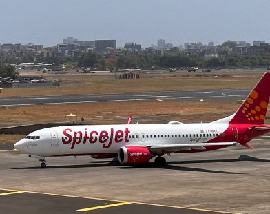 SpiceJet passenger airplane on a runway, with the SpiceJet logo prominent on the tail fin.