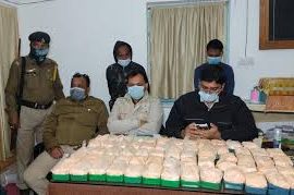 Police officers and officials displaying seized narcotics, highlighting the issue of Tripura drug abuse.