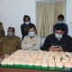 Police officers and officials displaying seized narcotics, highlighting the issue of Tripura drug abuse.