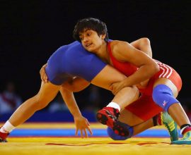 Vinesh Phogat grappling with an opponent during a wrestling match. Phogat was later disqualified from the competition.